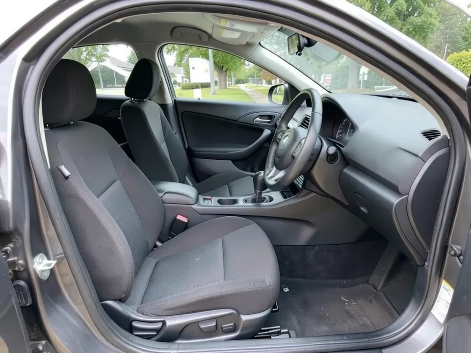 AI-drawn sample: the front seats of a sedan with black cloth upholstery, seen through the open driver door