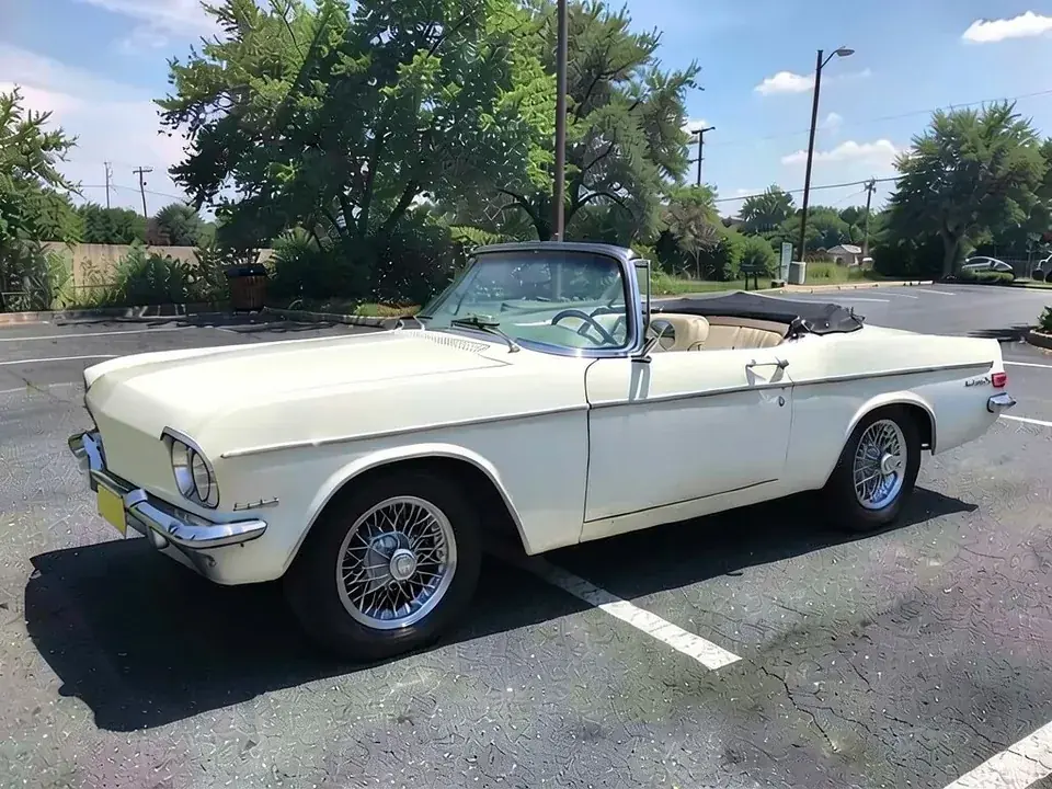 AI-drawn sample: a white classic convertible with chrome trim and wire wheels in a parking lot