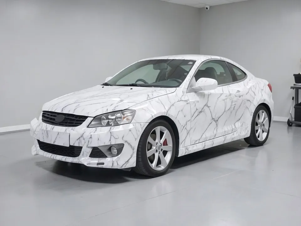 AI-drawn sample: the same coupe in a white marble wrap with gray veins