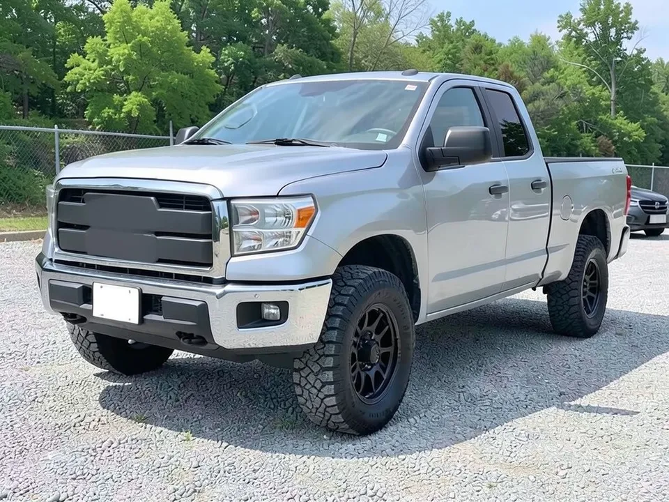 AI-drawn sample: a plain silver full-size pickup truck with a chrome bumper and black wheels on a gravel lot