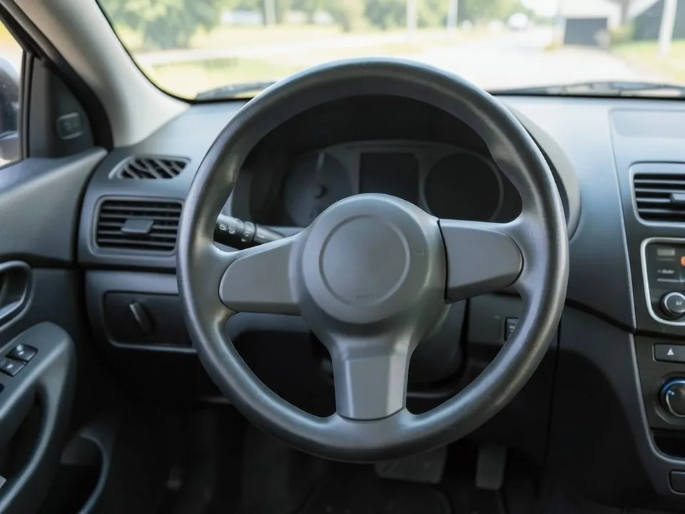 AI-drawn sample: a plain black three-spoke steering wheel and dashboard seen from the driver seat