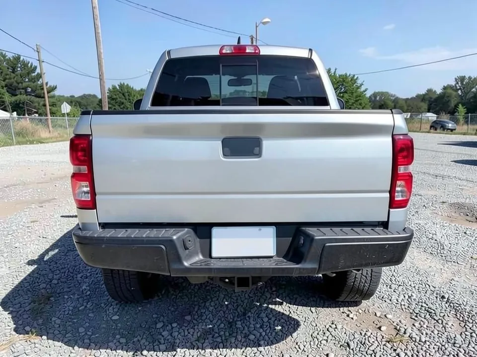 AI-drawn sample: the rear of a plain silver mid-size pickup on a gravel lot