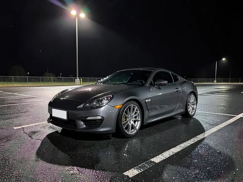 AI-drawn sample: a dark gray two-door coupe in an empty wet parking lot at night