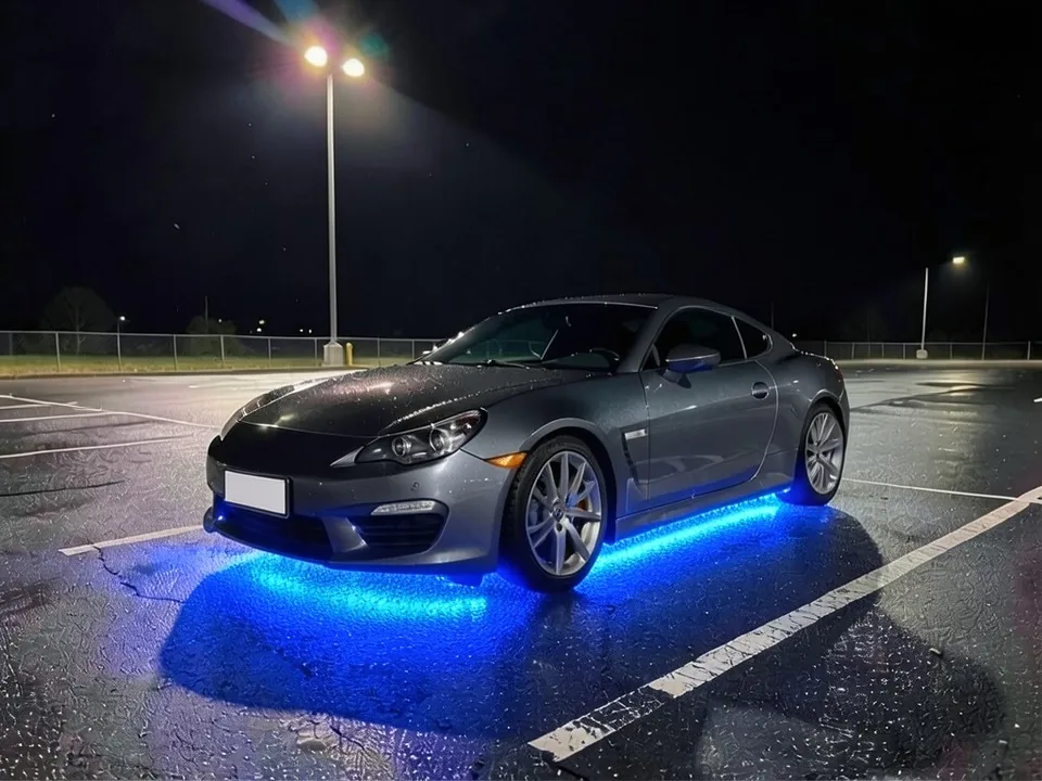 AI-drawn sample: the same coupe with blue underglow lighting the asphalt beneath it